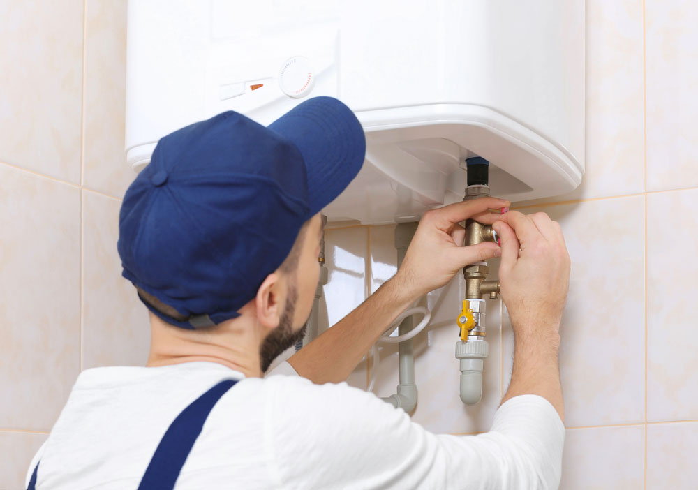 plumber repairing water heater
