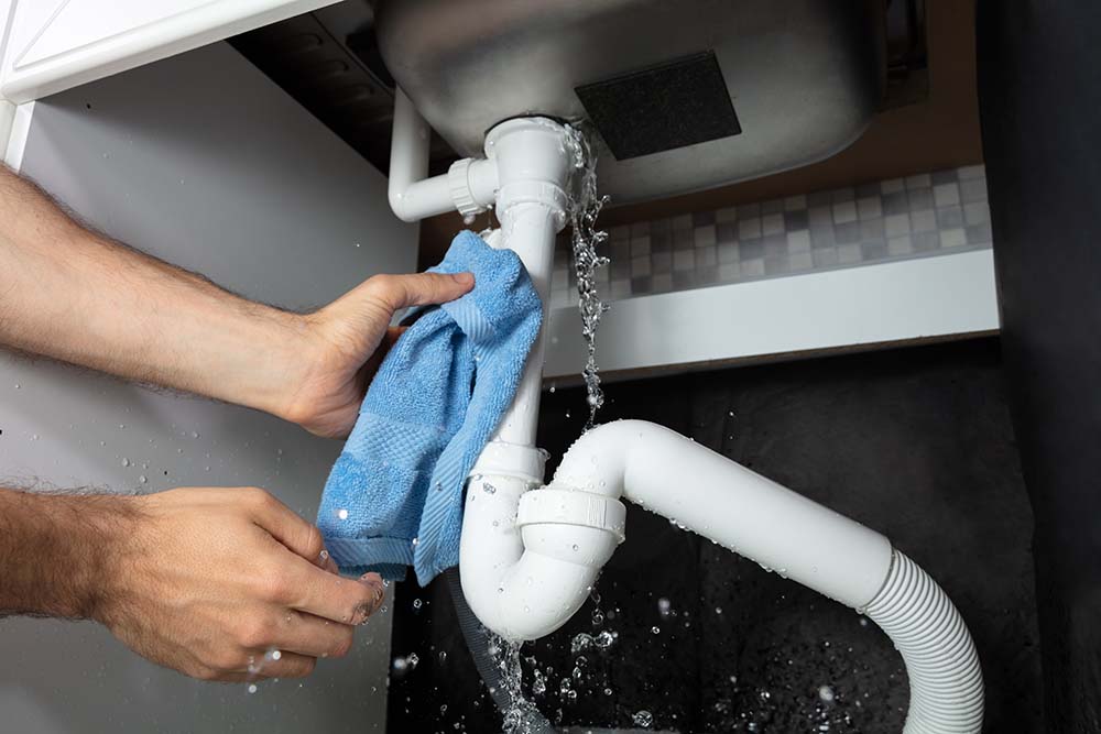 leaking water pipe under sink