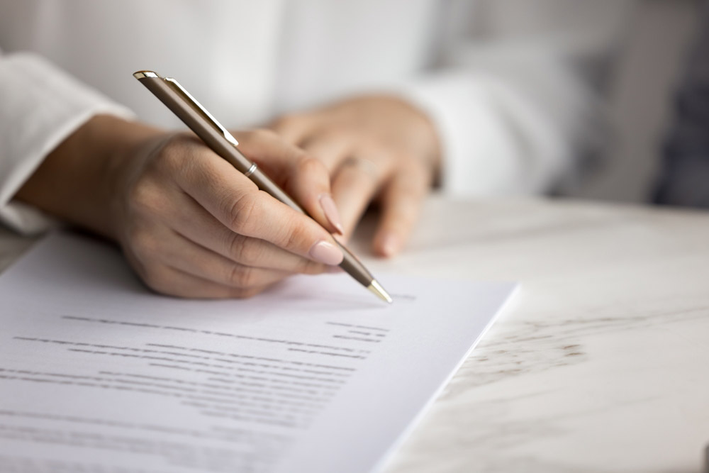 homeowner signing a service agreement
