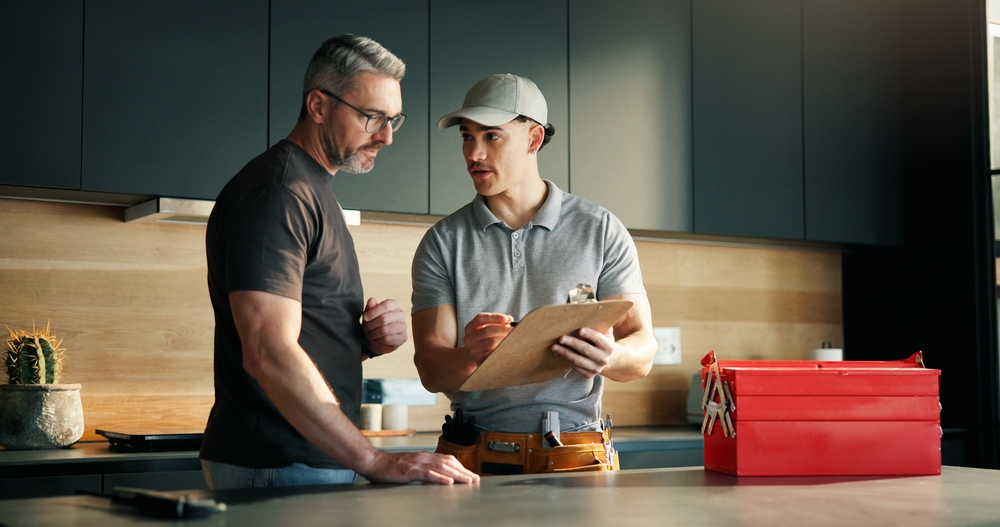 person talking to a plumber