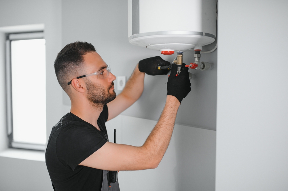 plumber installing water heater