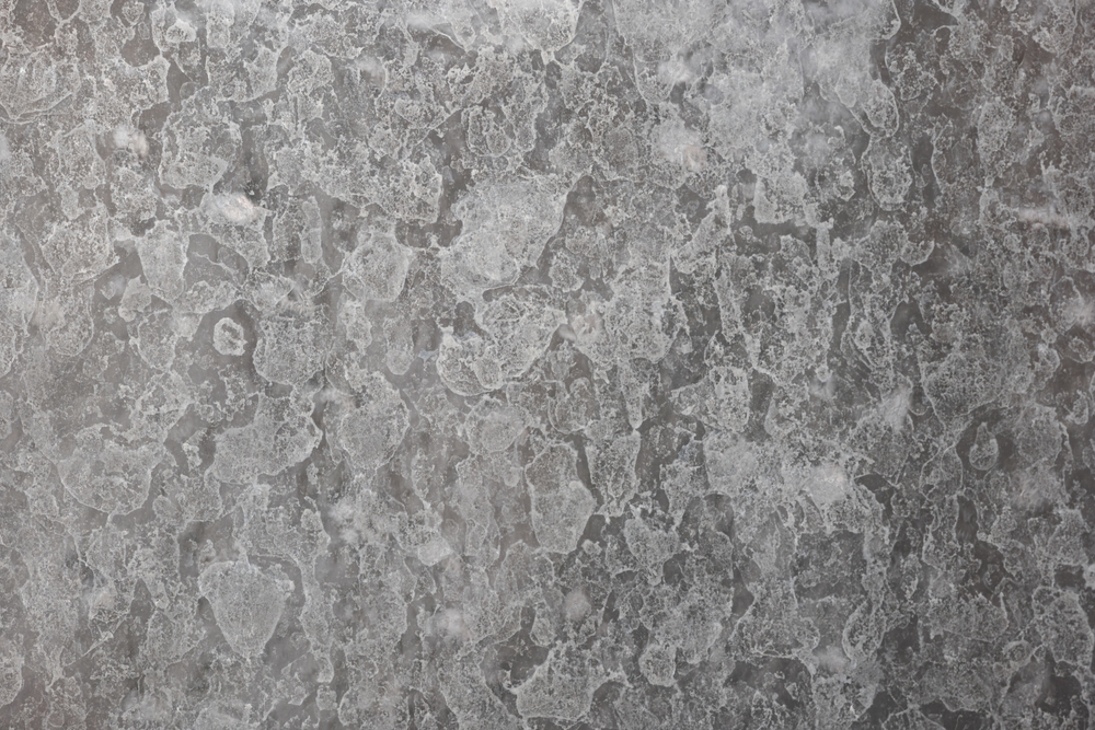 Hard water Calcium or lime scale deposit stains on a shower glass window